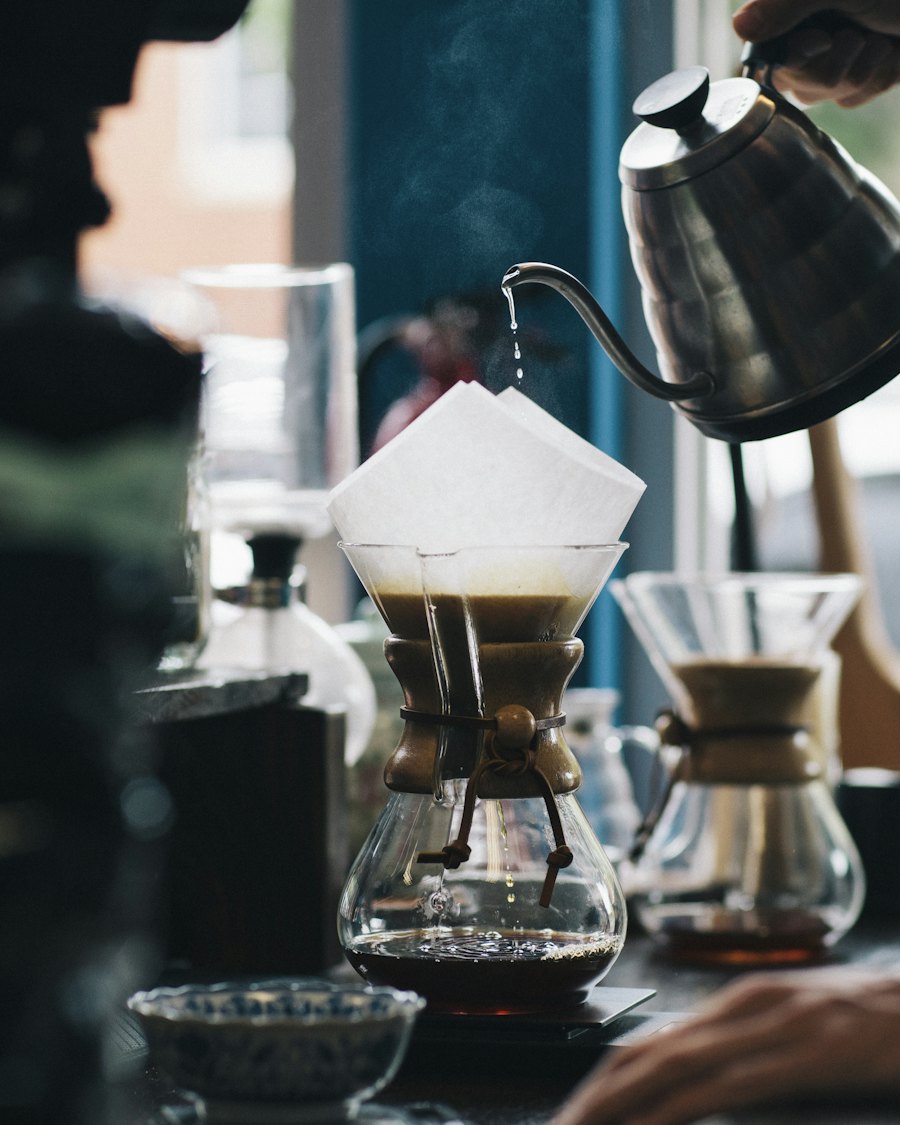 A barista pouring coffee in a café