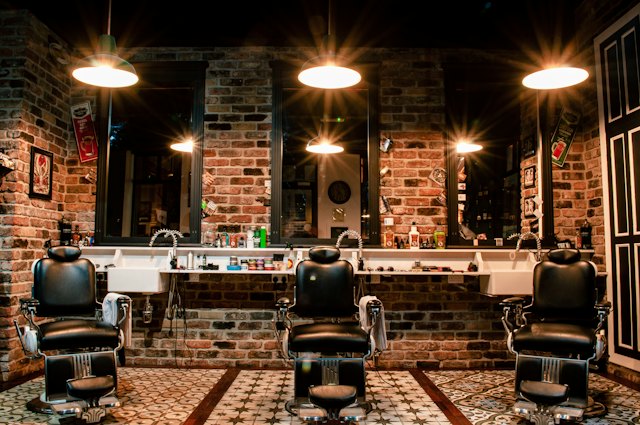 A barber shop with three chairs